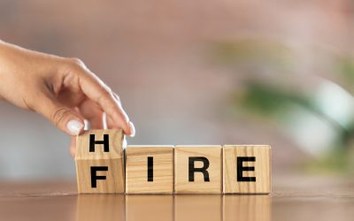 Children's cubes, blocks with word FIRE in female hand. Conceptual image about human rights